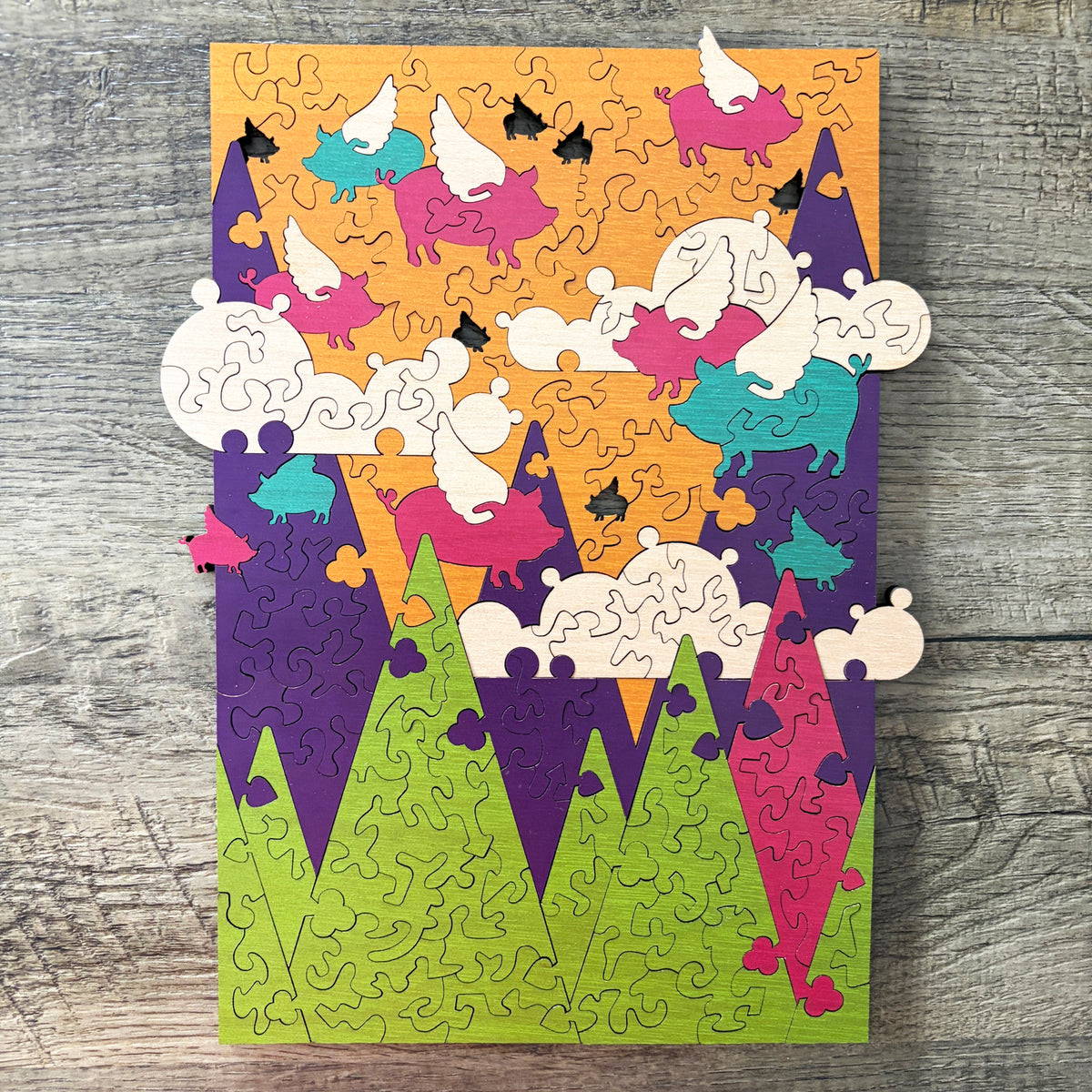 Porcine Ascent unique wooden jigsaw puzzle featuring whimsical flying pigs – Puzzle Bomb Bumfuzzled